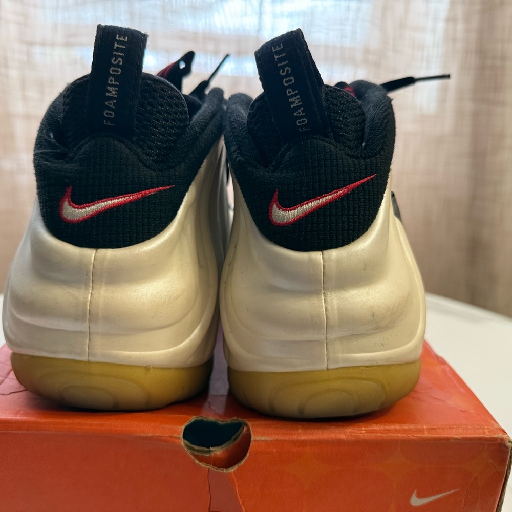 Nike Metallic Silver Foamposite Sneakers with Black and Red Accents